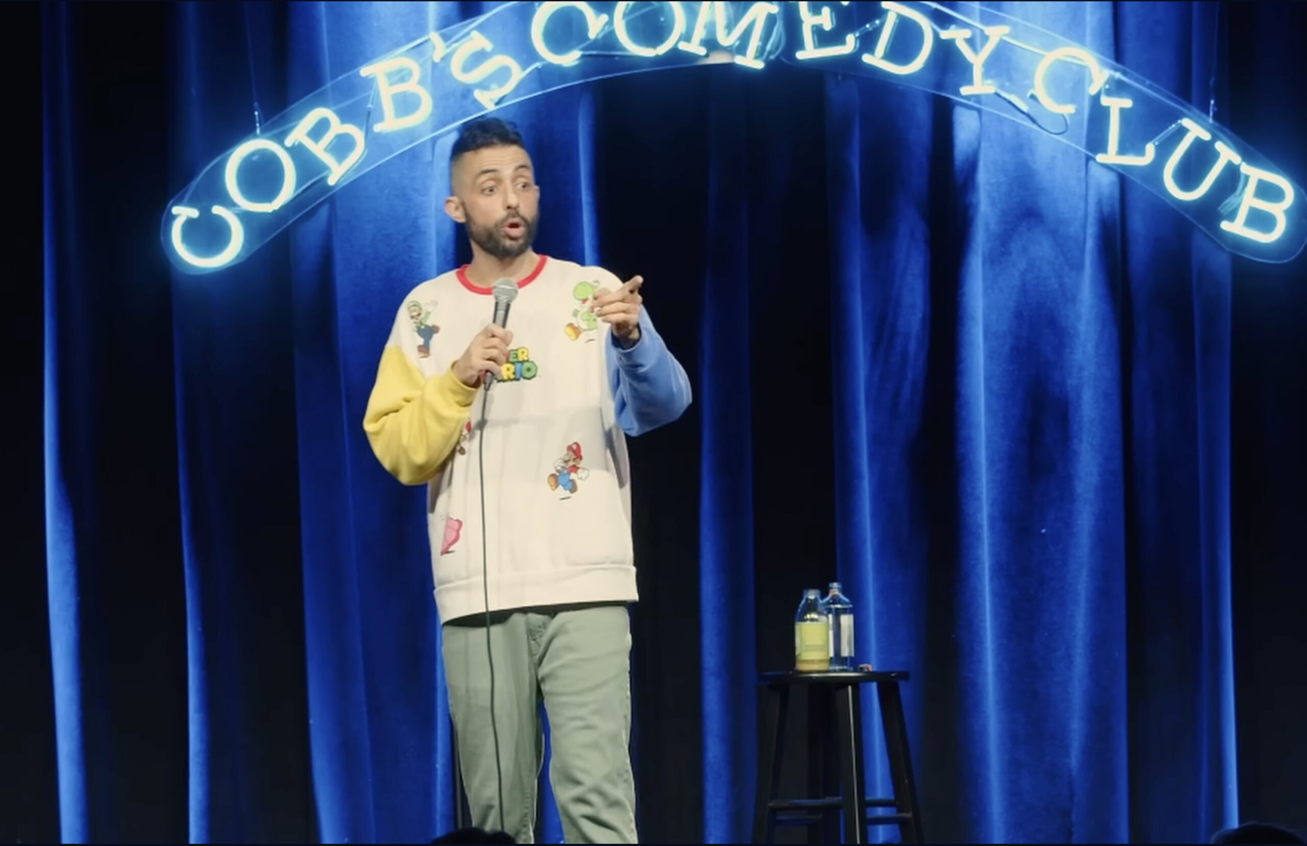 Sammy Obeid performs standup comedy in a video titled “AIPAC LIES, COLLEGE PROTESTS, & ANTISEMITISM” as part of his comedy special “Social Justice J1hadi.” (Screenshot/YouTube)